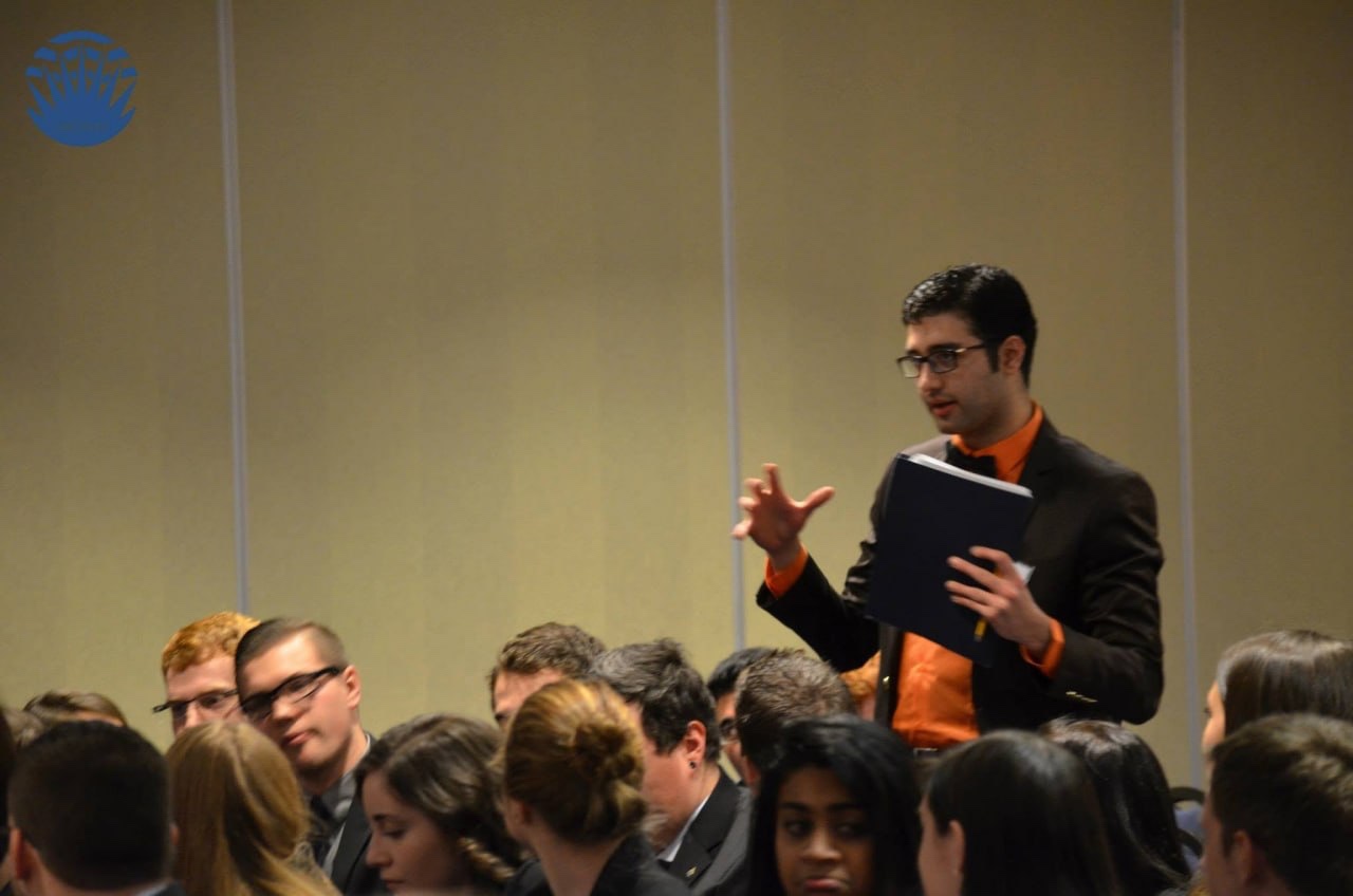Saman Arfaie addressing fellow delegates at a Model United Nations conference